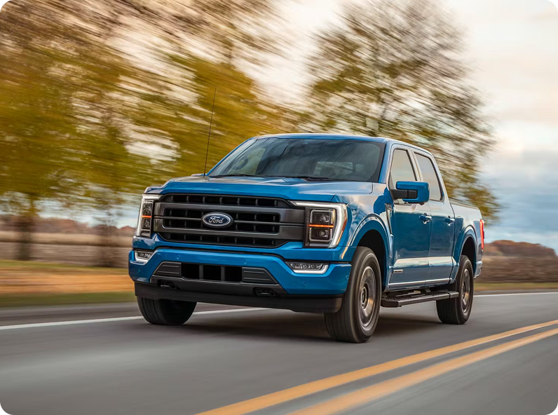 Blue pickup truck on open road